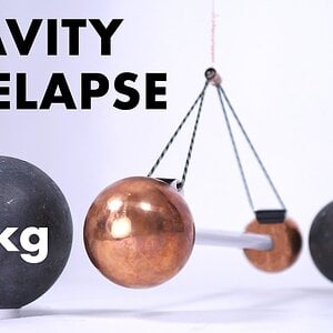 Watch gravity pull two metal balls together