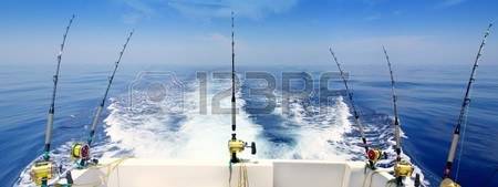 8051629-boat-fishing-trolling-panoramic-rod-and-reels-blue-sea-wake.jpg