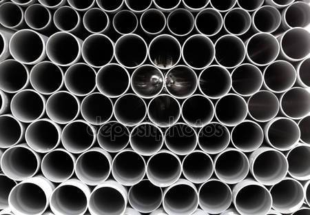 dep_6946686-Gray-PVC-tubes-plastic-pipes-stacked-in-rows.jpg